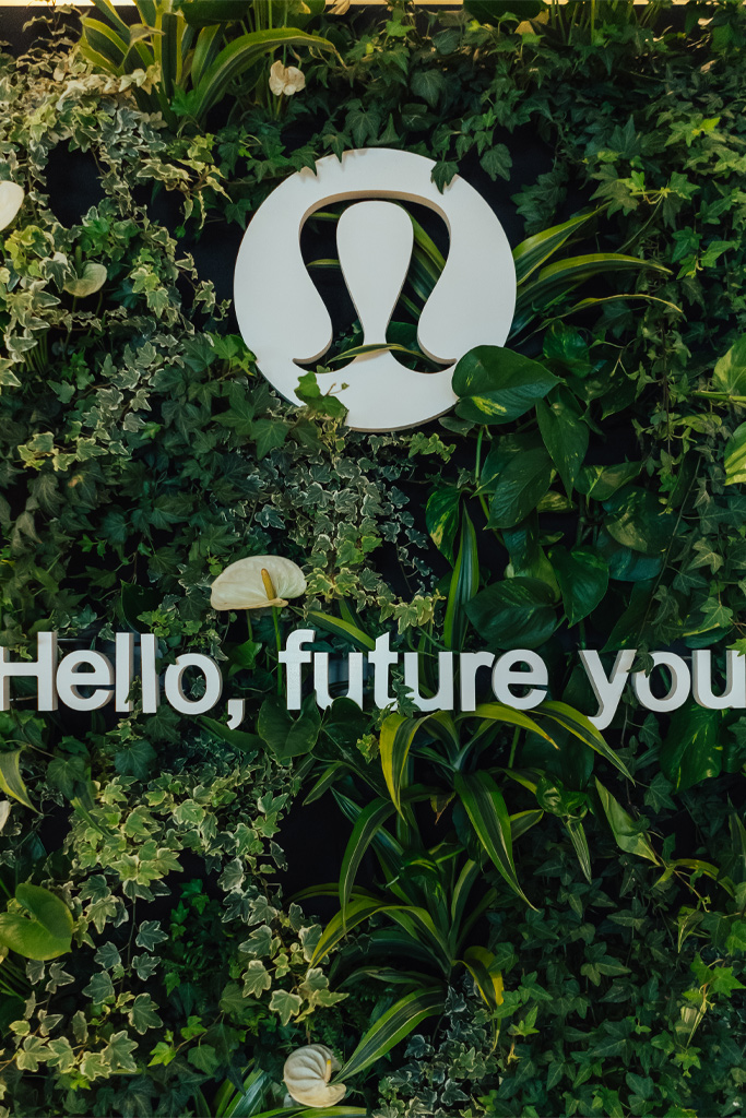 Plant wall with Lululemon logo for and event styled by Joy By Joelle.